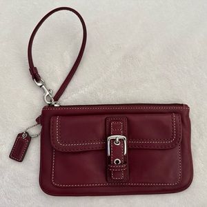Like new burgundy Coach Buckle Wristlet